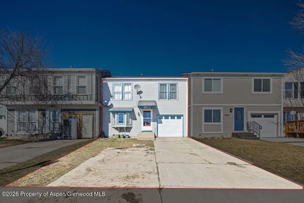 a view of a house with a street