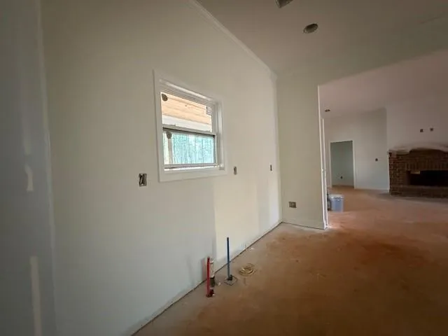 a view of an empty room and window