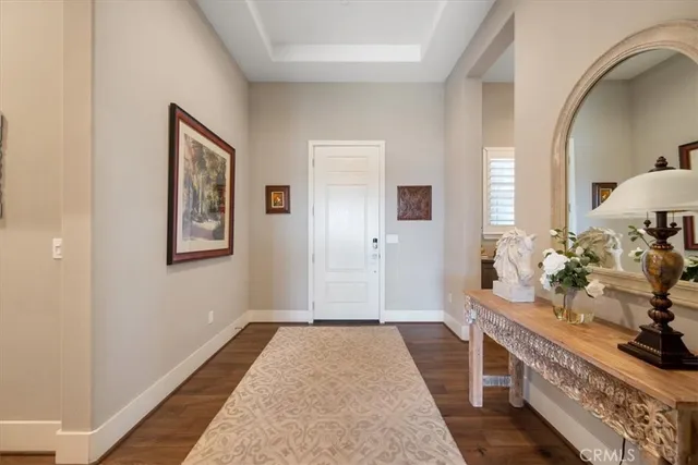 a living room with fireplace furniture and a wooden floor