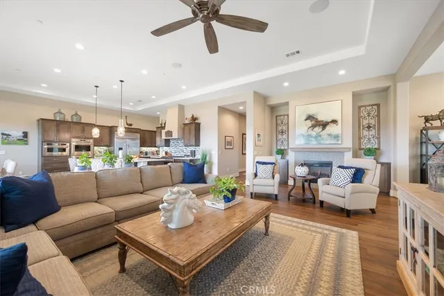 a dining room with furniture and wooden floor