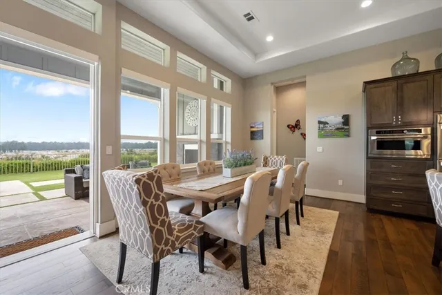 a large kitchen with a table and chairs