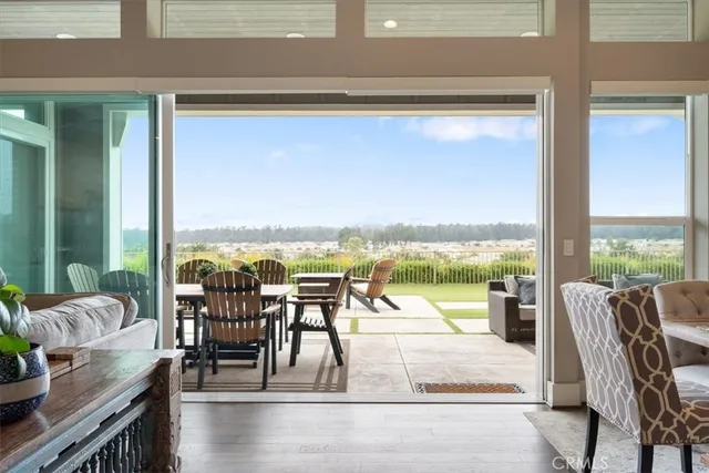 a view of a balcony with chair and a floor to ceiling window