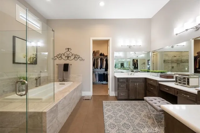 a large kitchen with a sink and cabinets