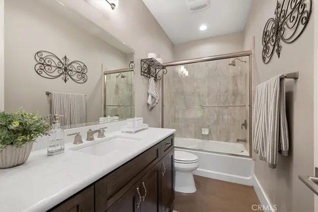 a utility room with cabinets washer and dryer