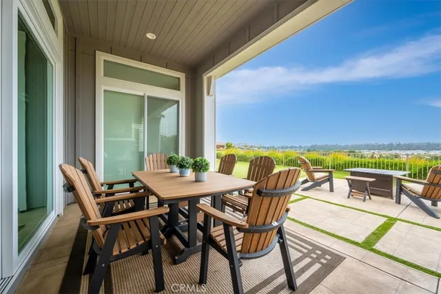 a dining space with a table and chairs