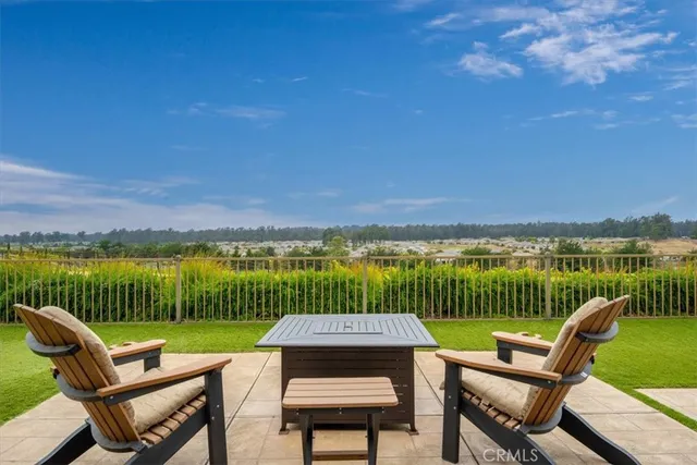 a view of a patio with a big yard