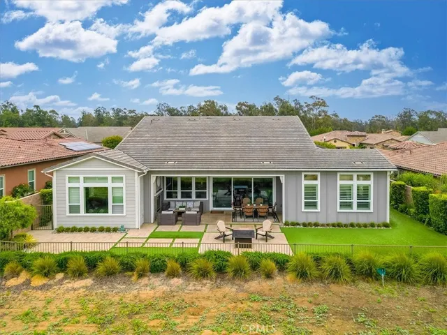 a front view of a house with porch and garden
