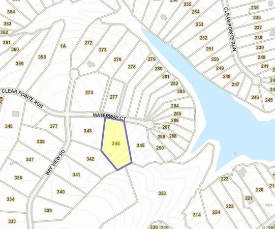 a view of backyard with table and chairs and wooden fence