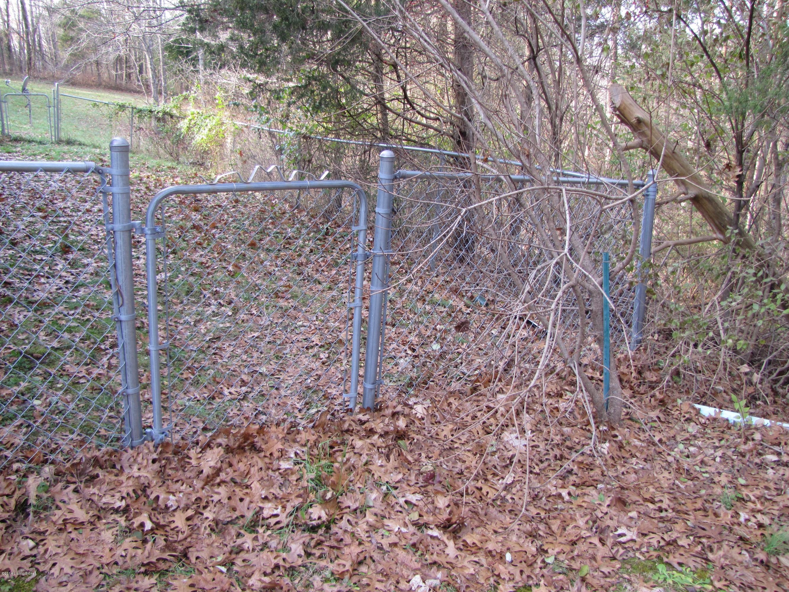 218 Fox Run Road Pendleton, KY 40055 - Photo 50 of 54 The rear yard is fenced; great for pets or small children. Gates are found on either side of the fenced area.