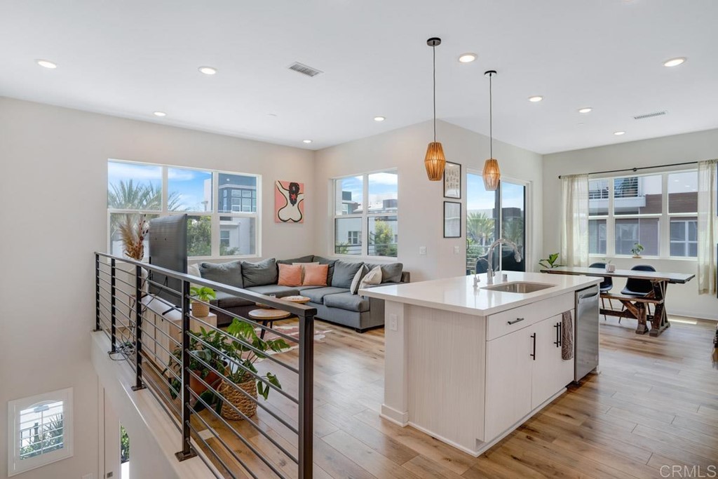 2048 Bravo Loop, Unit 2 Chula Vista, CA 91915 - Photo 1 of 34 a open kitchen with stainless steel appliances granite countertop a stove and a view of living room