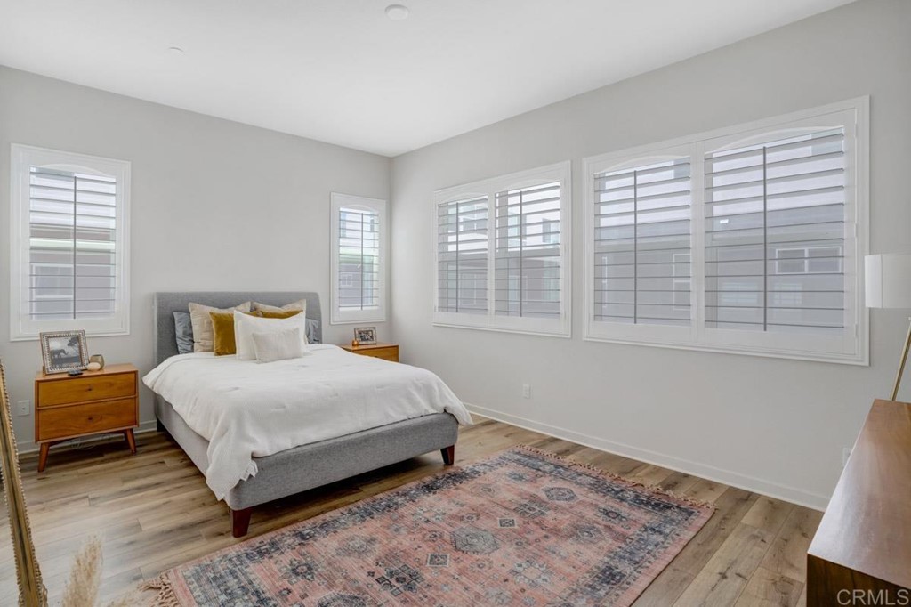 2048 Bravo Loop, Unit 2 Chula Vista, CA 91915 - Photo 15 of 34 a large bed sitting in a bedroom next to a window
