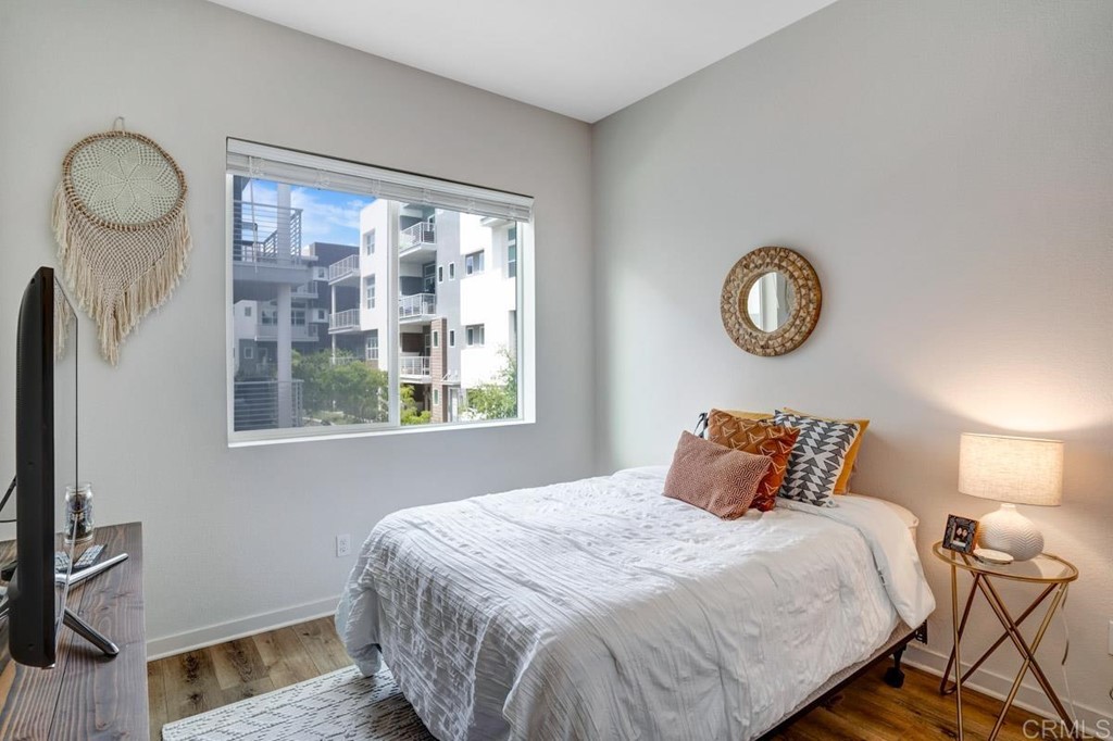 2048 Bravo Loop, Unit 2 Chula Vista, CA 91915 - Photo 20 of 34 a bedroom with a bed and a window
