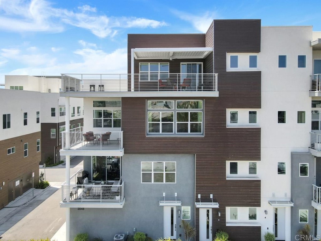 2048 Bravo Loop, Unit 2 Chula Vista, CA 91915 - Photo 23 of 34 a view of a building with many windows