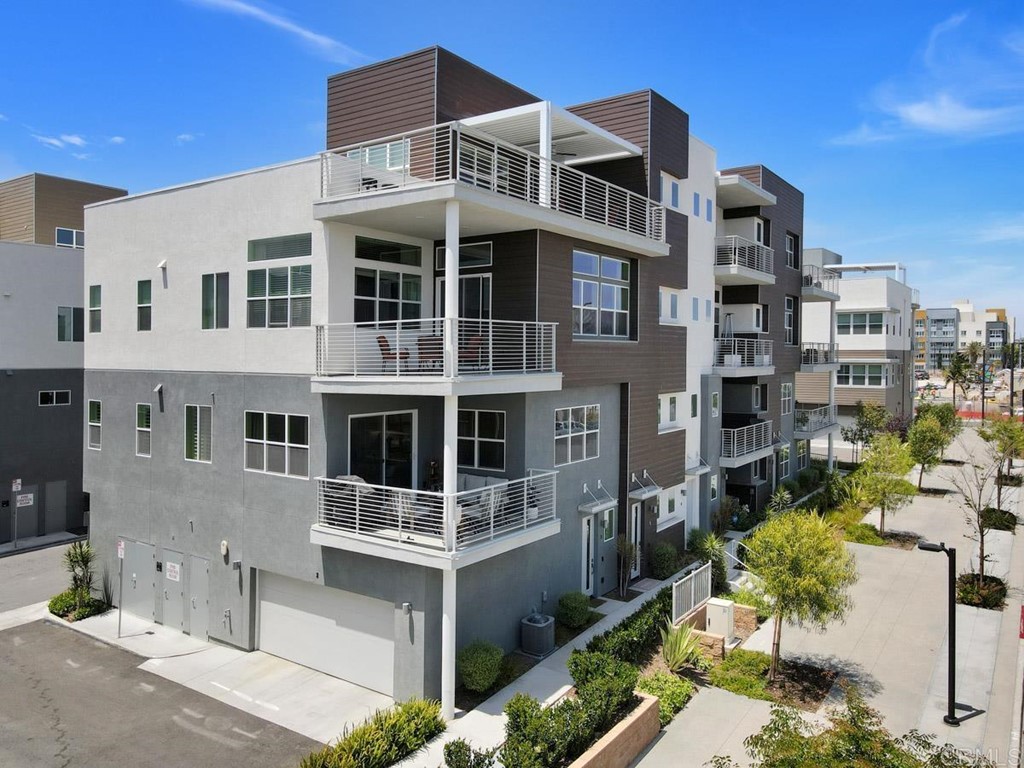 2048 Bravo Loop, Unit 2 Chula Vista, CA 91915 - Photo 24 of 34 a front view of a building with a garden and balcony