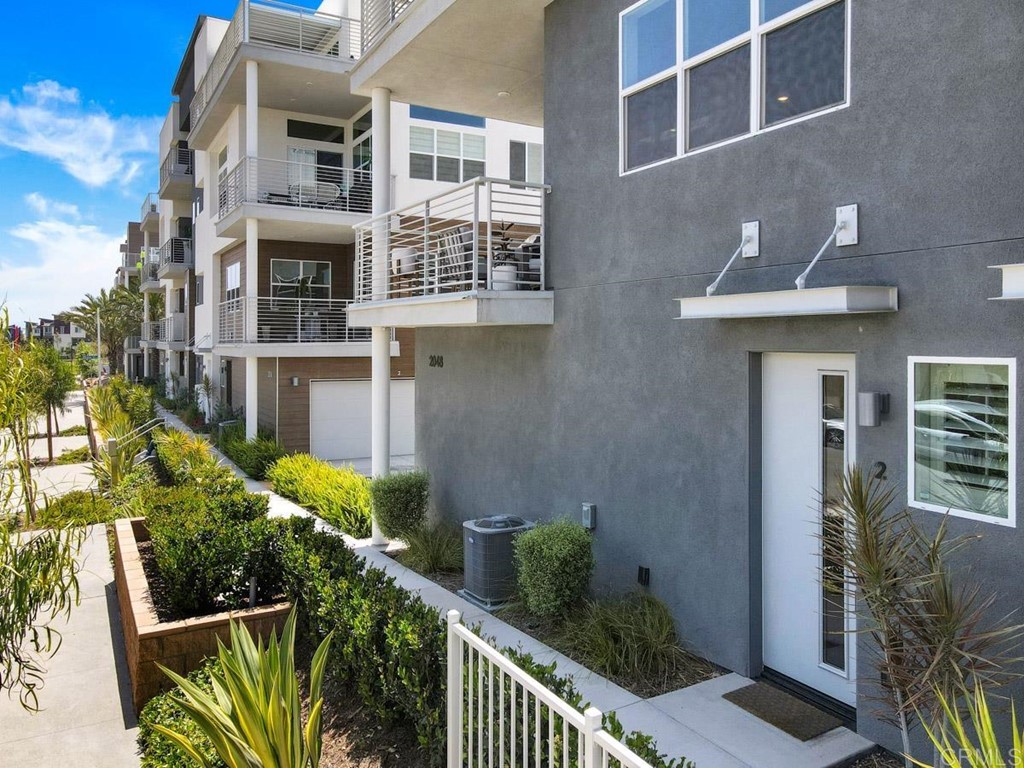 2048 Bravo Loop, Unit 2 Chula Vista, CA 91915 - Photo 27 of 34 a front view of a house with outdoor seating and plants