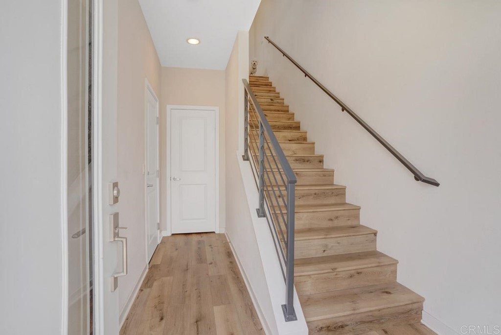 2048 Bravo Loop, Unit 2 Chula Vista, CA 91915 - Photo 34 of 34 a view of a hallway with wooden floor and entryway