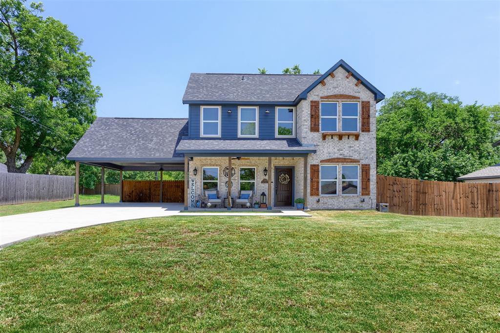 front view of a house with a yard
