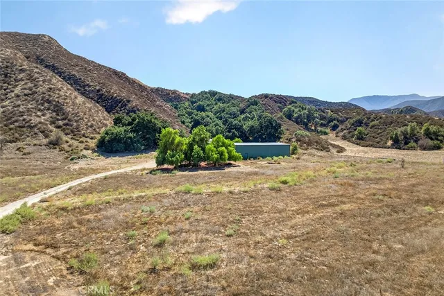 a view of a street with a mountain