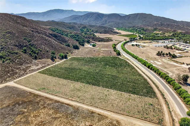 a living room with lots of furniture and a chandelier