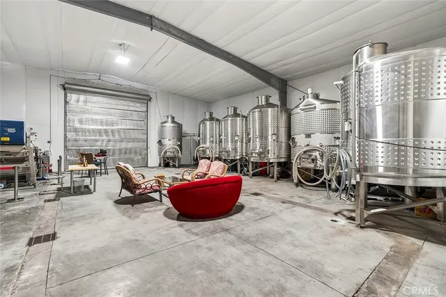 a living room with furniture a rug and a fireplace