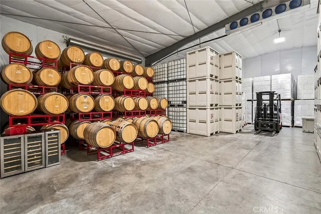 a view of a room with wooden walls and painting on the wall