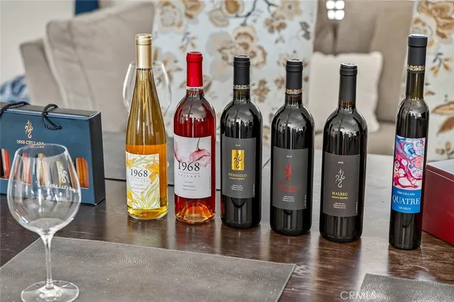 a view of a lush green field with mountains in the background