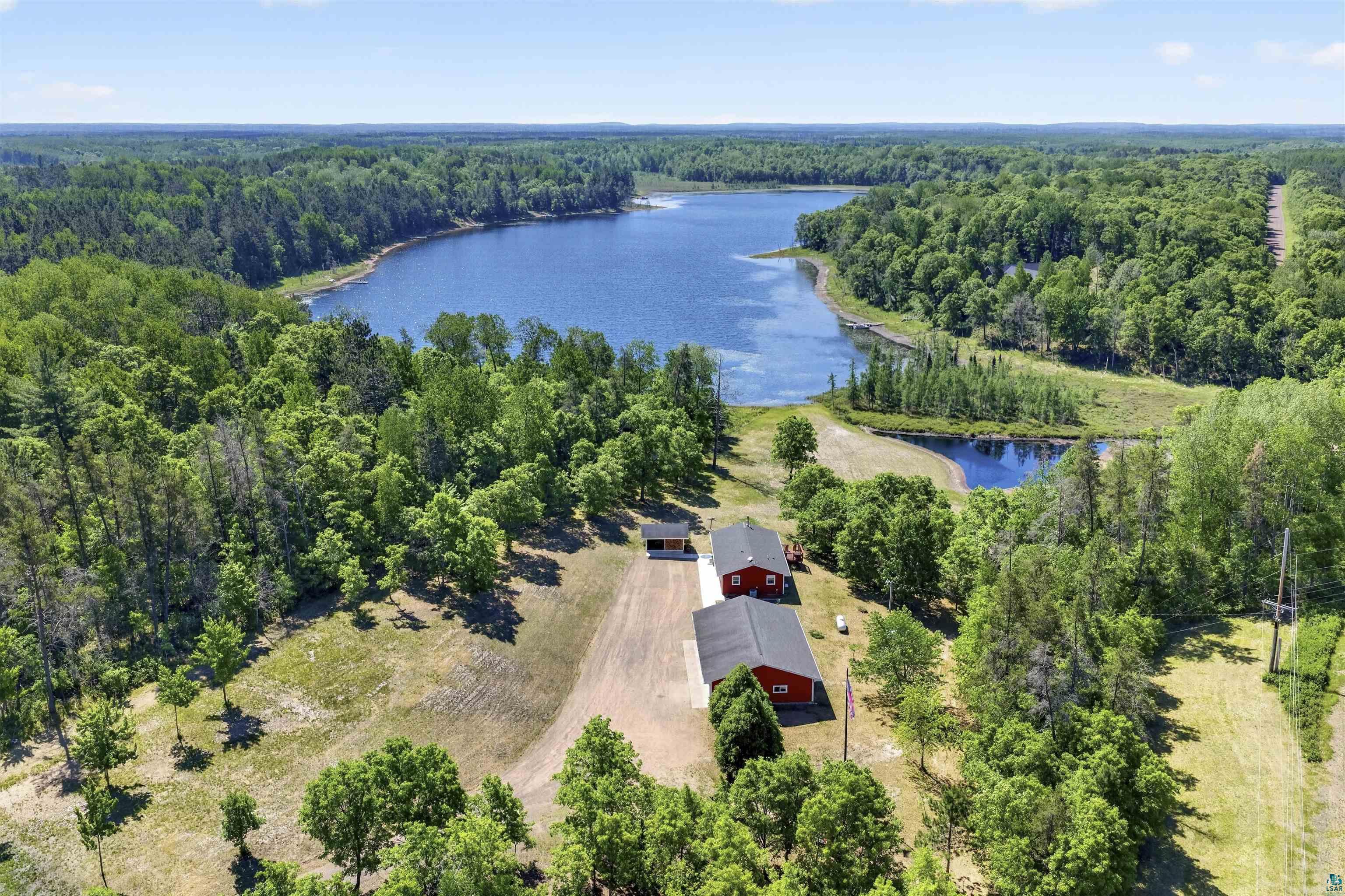 11702 East Mail Road Gordon, WI 54838 - Photo 11 of 60 Expansive waterfront property featuring a large lake and surrounding woodlands