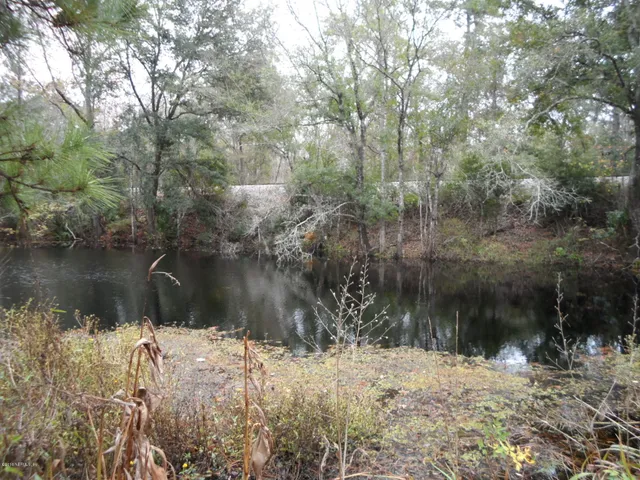 a view of lake with a yard