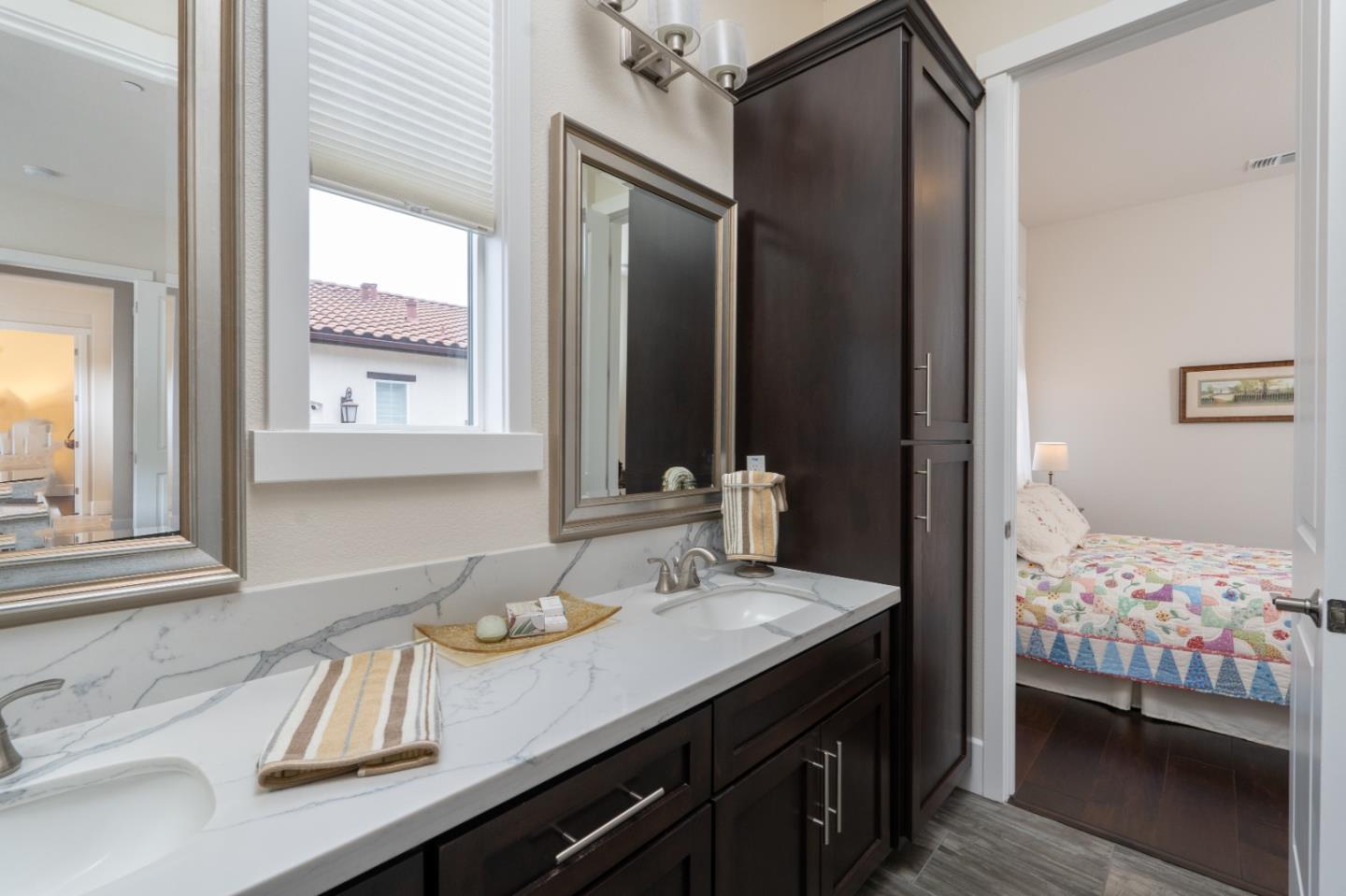 18527 McClellan Circle Marina, CA 93933 - Photo 17 of 35 a en suite bathroom with a sink double vanity and a mirror