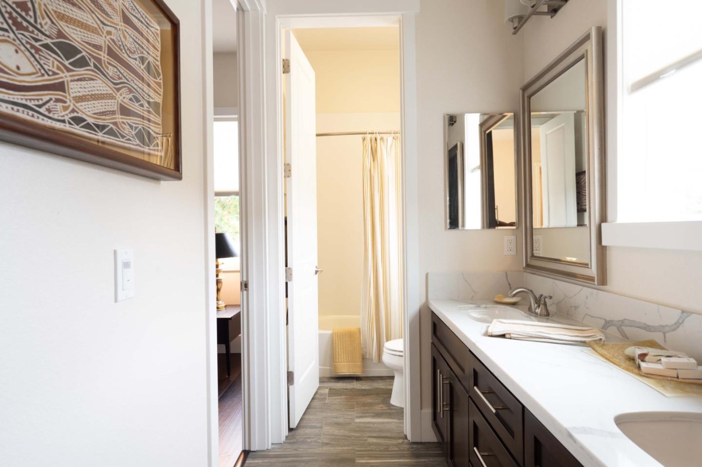 18527 McClellan Circle Marina, CA 93933 - Photo 18 of 35 a bathroom with a double vanity sink and a mirror