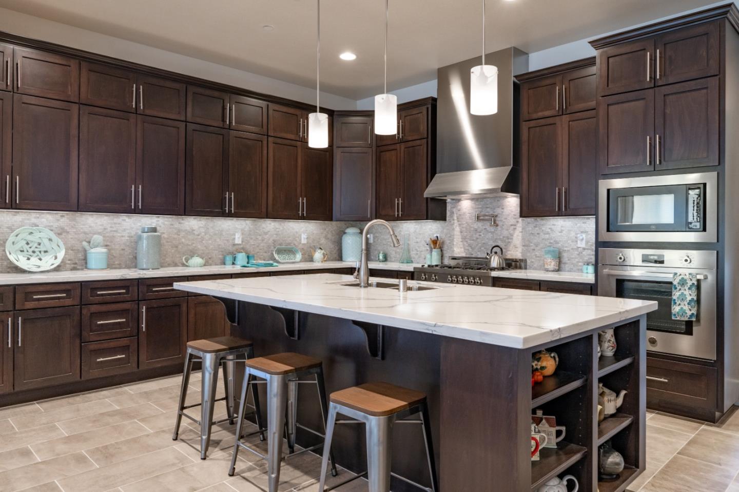 18527 McClellan Circle Marina, CA 93933 - Photo 5 of 35 a kitchen with a table chairs sink and cabinets
