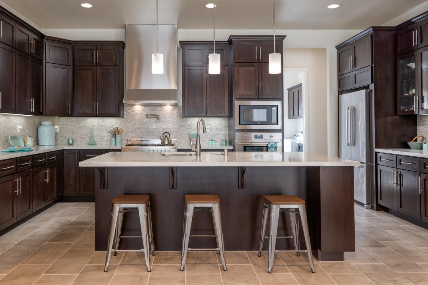 18527 McClellan Circle Marina, CA 93933 - Photo 6 of 35 a kitchen with granite countertop a sink counter top space cabinets and stainless steel appliances