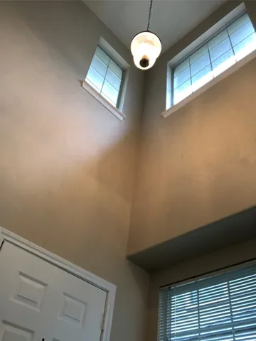 a view of a hallway with a window