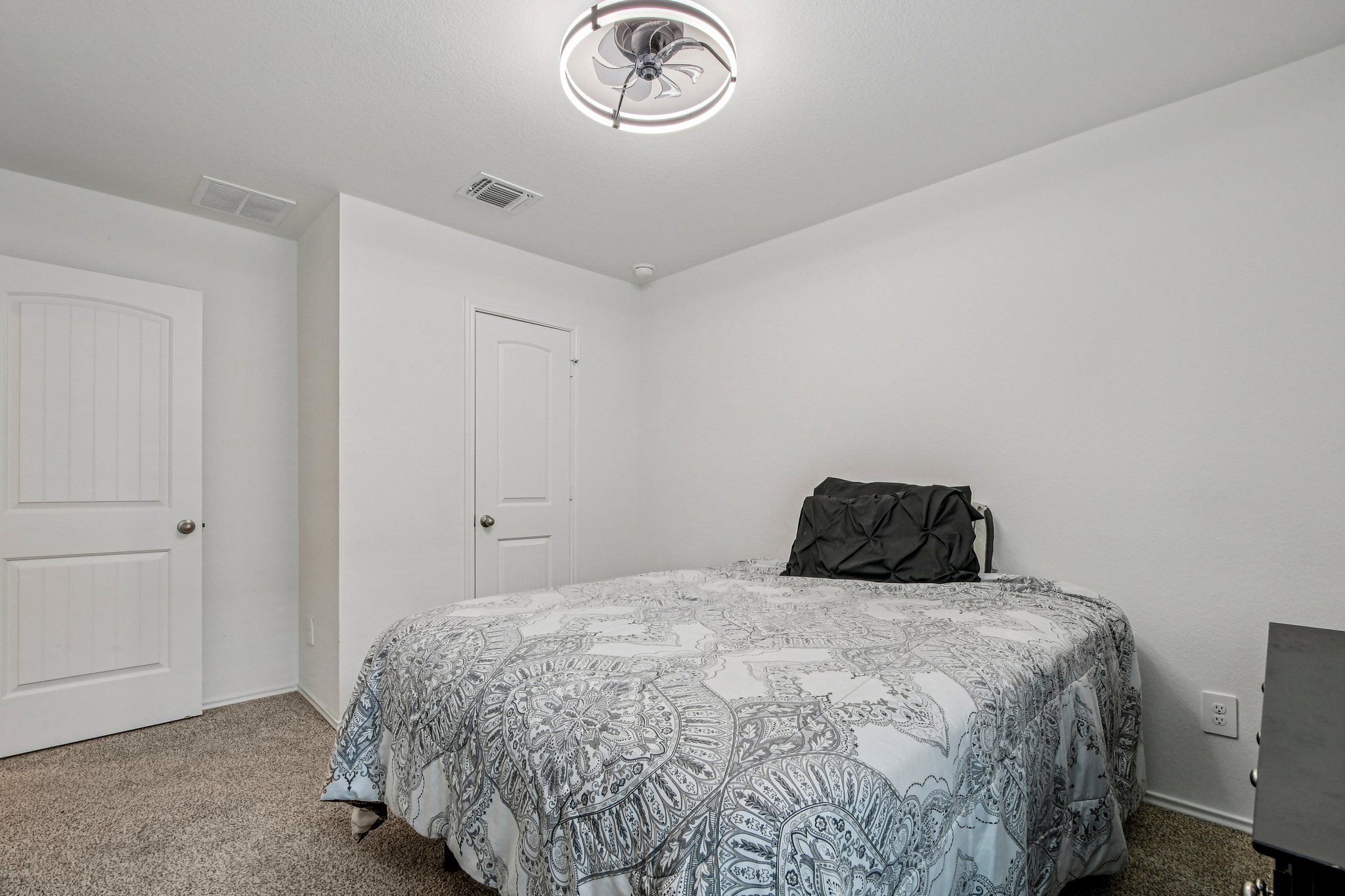 519 Sandringham Loop Kyle, TX 78640 - Photo 17 of 32 Bedroom with carpet and baseboards