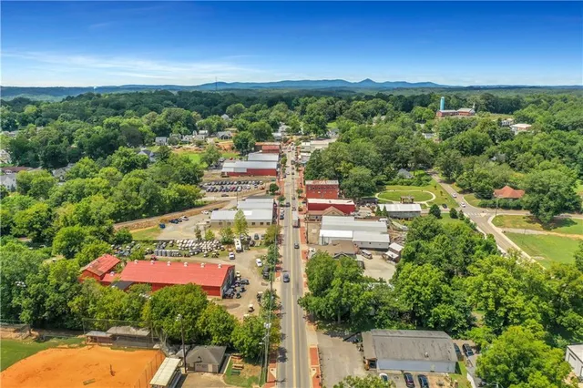 an aerial view of a house with outdoor space