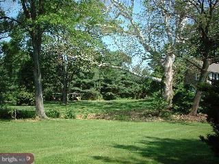 230 Sproul Road Villanova, PA 19085 - Photo 3 of 3 a view of a grassy field with trees in the background