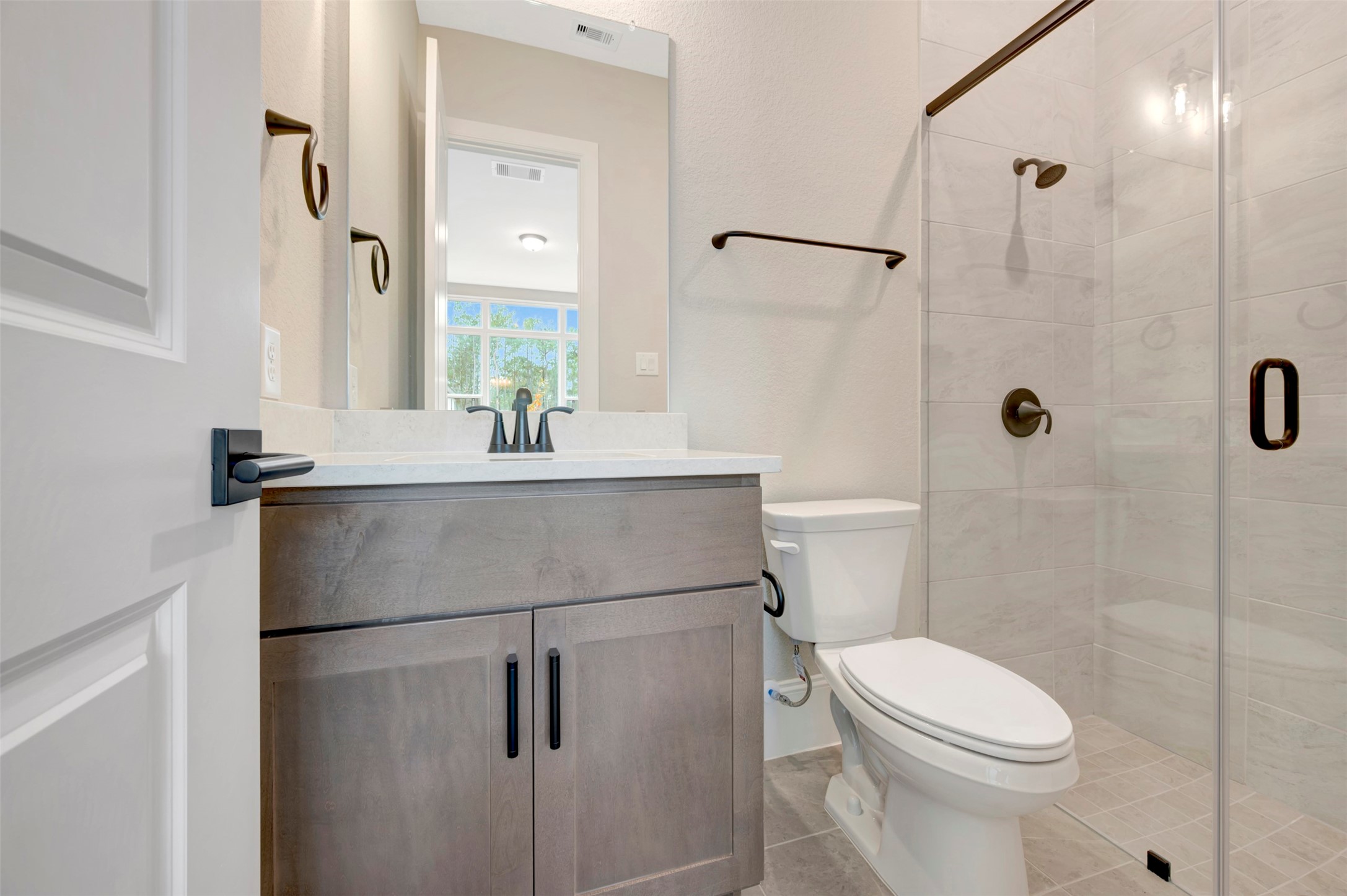119 Rustica Bloom Trail Willis, TX 77318 - Photo 13 of 50 a bathroom with a sink toilet and shower
