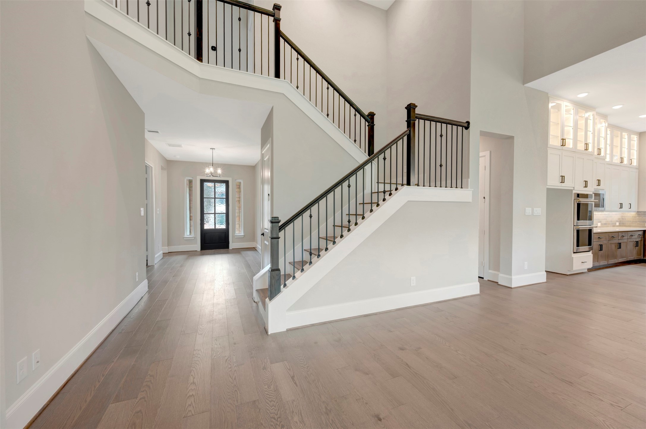 119 Rustica Bloom Trail Willis, TX 77318 - Photo 19 of 50 a view of a hallway with wooden floor and entryway
