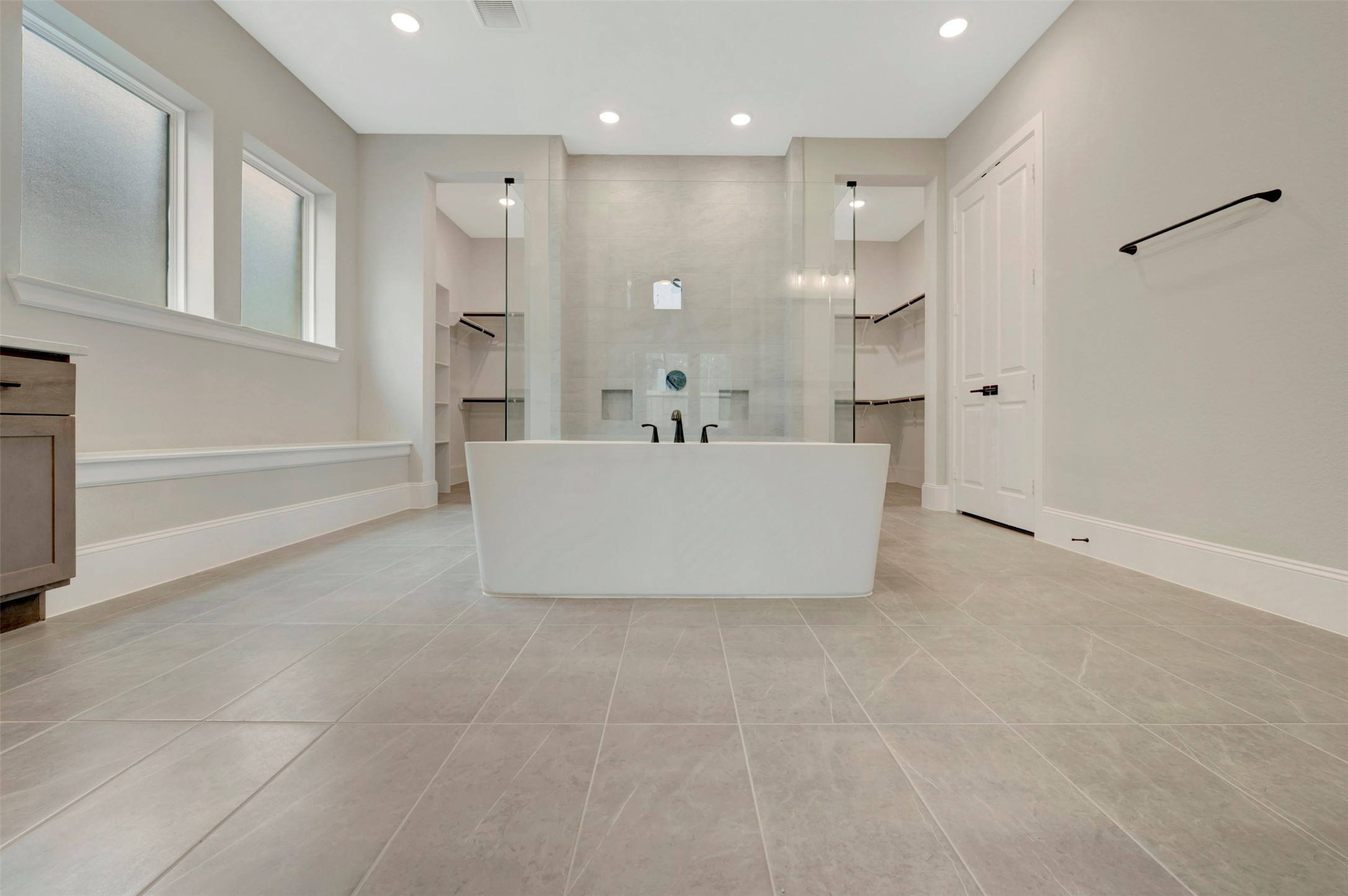119 Rustica Bloom Trail Willis, TX 77318 - Photo 22 of 50 a white bath tub sitting in a bathroom
