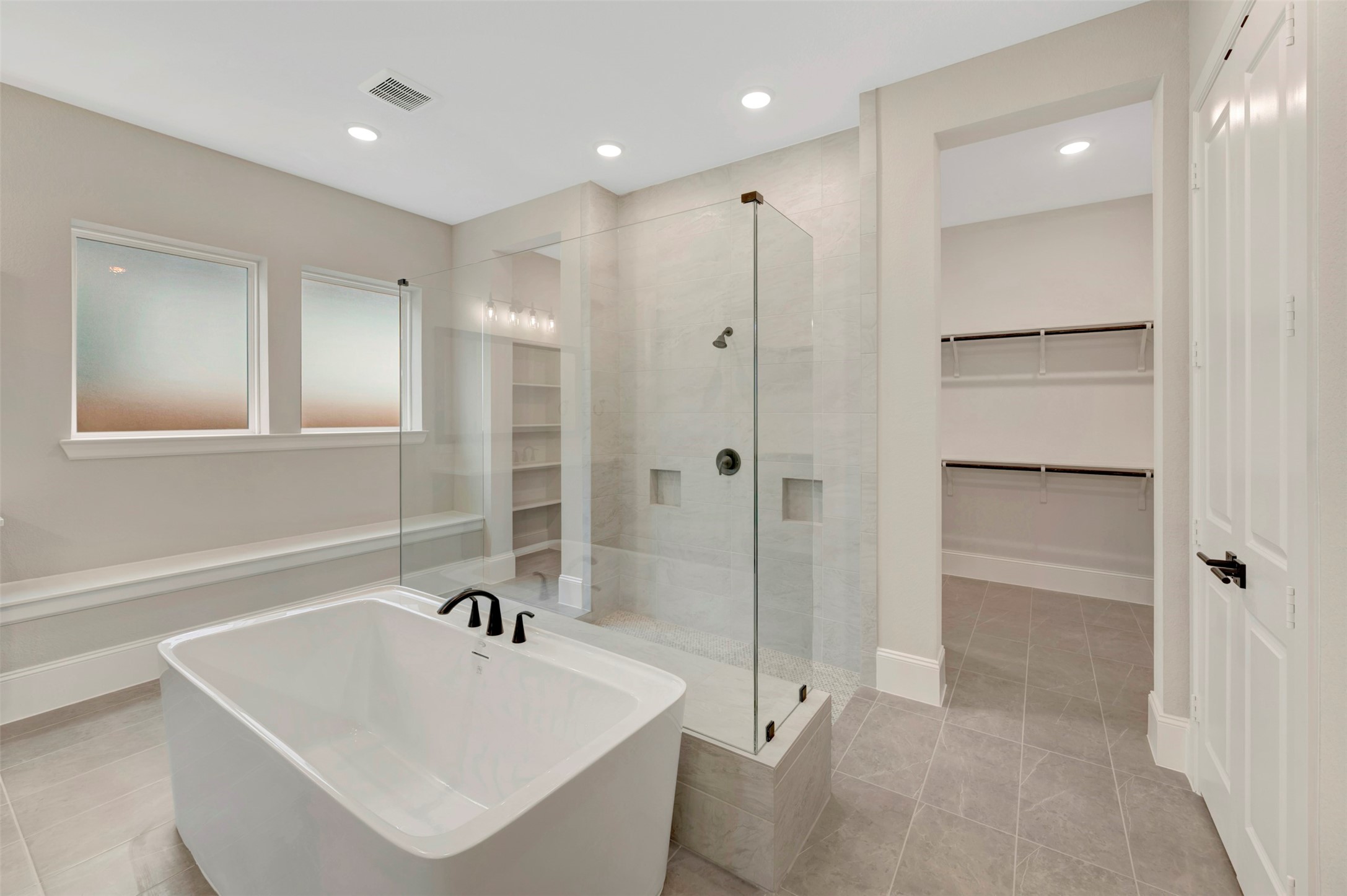 119 Rustica Bloom Trail Willis, TX 77318 - Photo 24 of 50 a bathroom with a bathtub and a sink