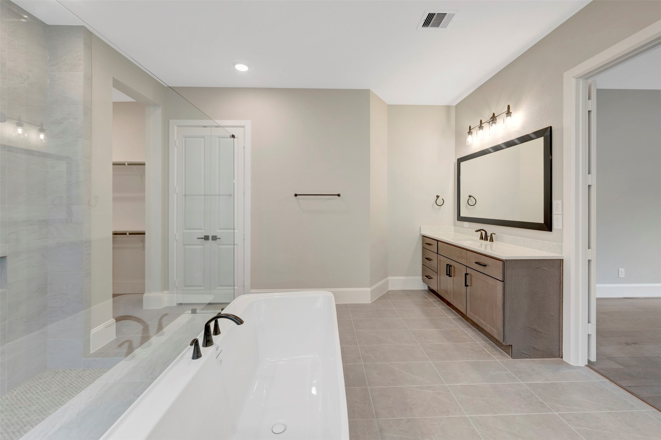 119 Rustica Bloom Trail Willis, TX 77318 - Photo 25 of 50 a spacious bathroom with a tub sink mirror and a bathtub