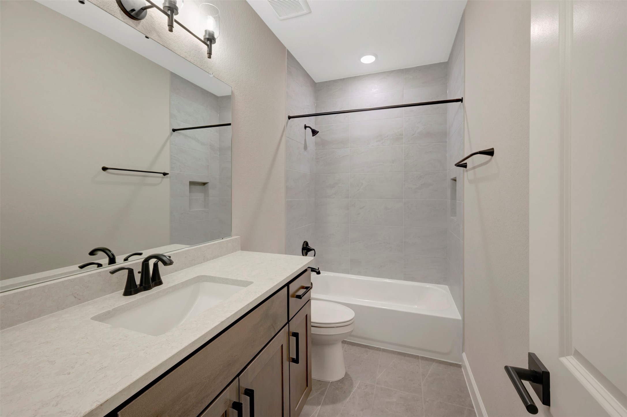 119 Rustica Bloom Trail Willis, TX 77318 - Photo 42 of 50 a bathroom with a sink a toilet and shower
