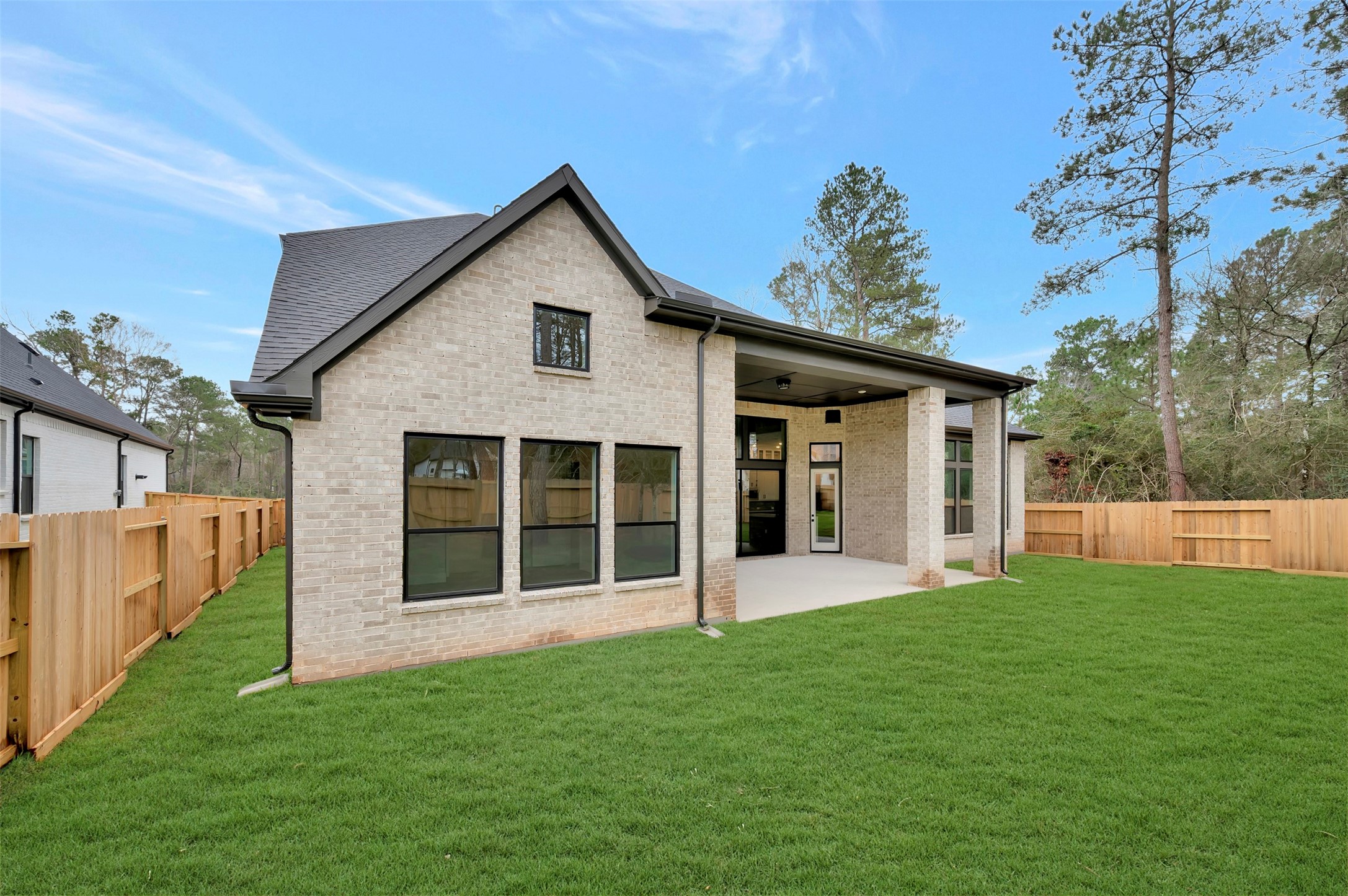 119 Rustica Bloom Trail Willis, TX 77318 - Photo 7 of 50 a view of a house with a yard and porch