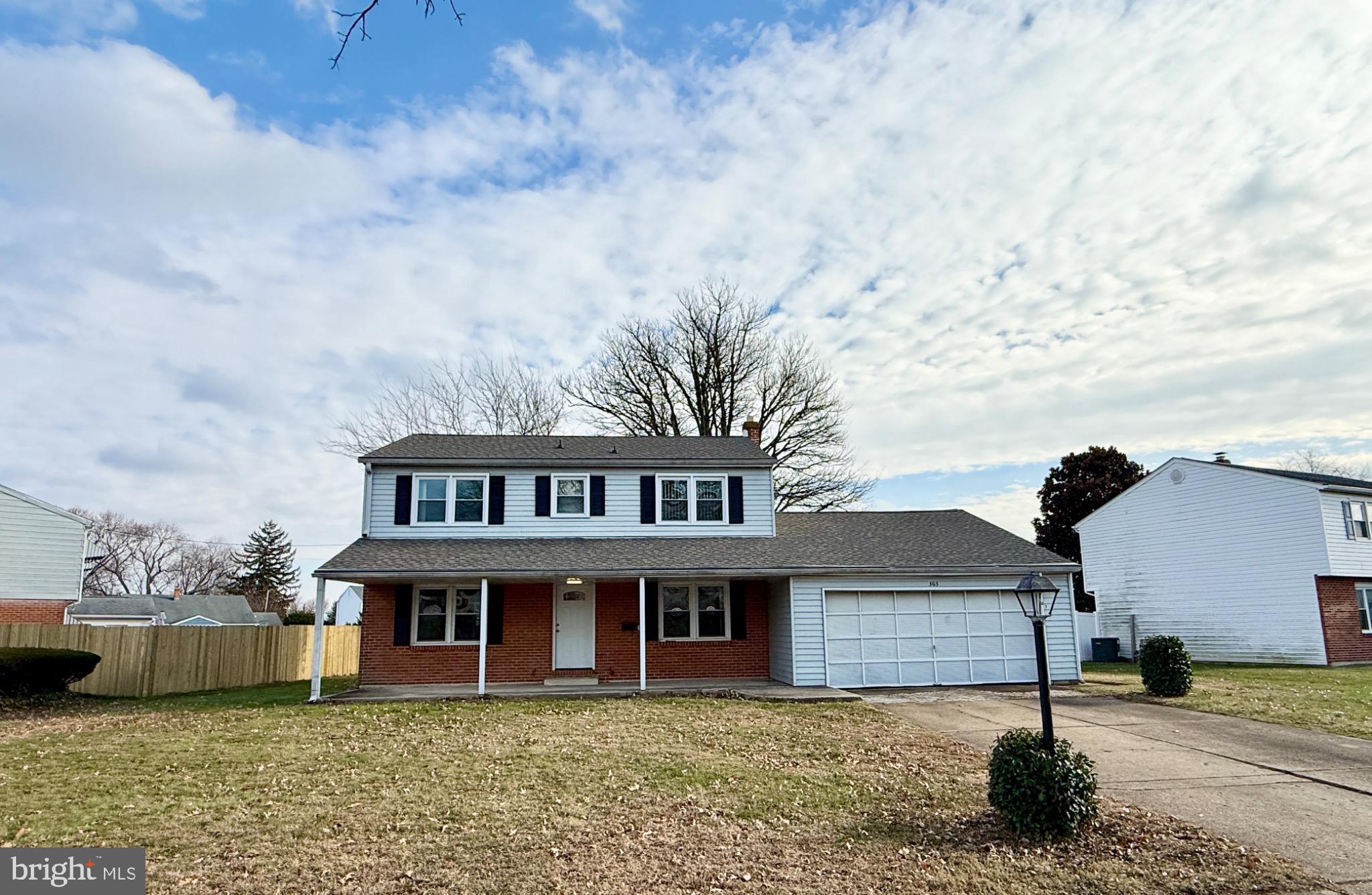303 Oregon Avenue New Castle, DE 19720 - Photo 2 of 40 a front view of a house with a garden