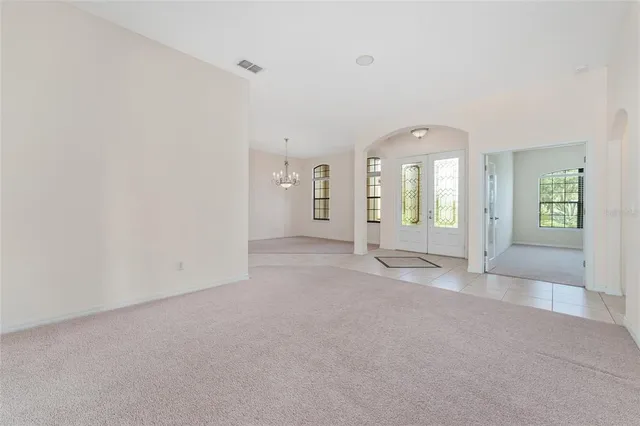 a spacious bathroom with a bathtub sink and mirror