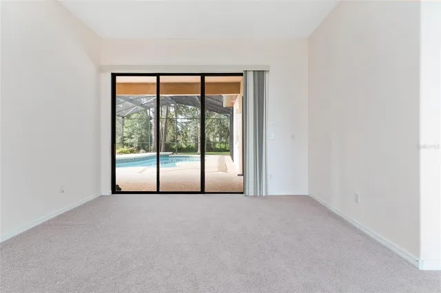 a white bath tub sitting in a bathroom next to a window