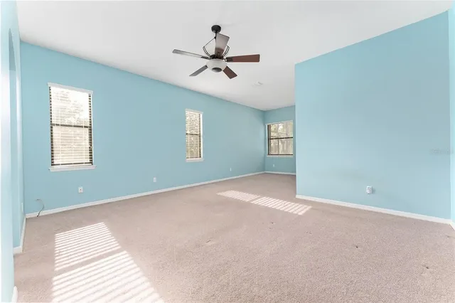 a kitchen with kitchen island granite countertop wooden cabinets and a counter top space