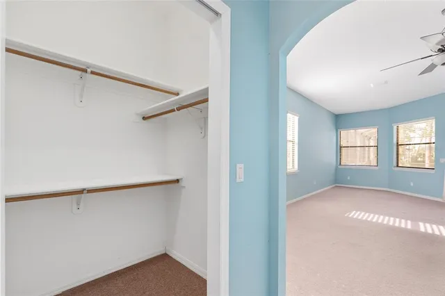 a bathroom with a granite countertop sink a toilet and bathtub