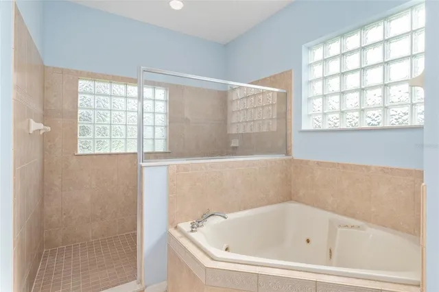 a view of an entryway with wooden floor and a livingroom
