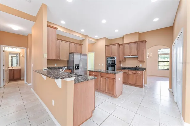 a view of empty room with a fireplace